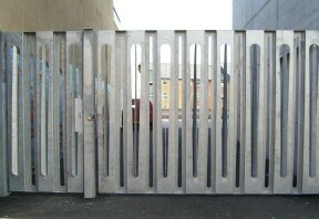 Main gates by Jennie Gill with architects Feilden Clegg Bradley.  Persistence Works, Sheffield.  Photo: Kate Dore 2001