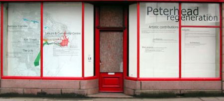 A shop on Kirk Street, Peterhead, that was cleaned up and which had proposals for the area displayed on the windows, using vinyl lettering, by Sans fa&ccedil;on, summer 2005. Photograph by Sans fa&ccedil;on.