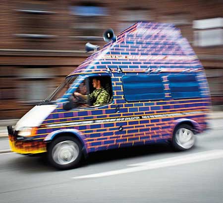 J & K's Babylon Shuttle Bus on the move. Part of the Sit Down! Project in Mimersgade, Copenhagen 2006. Photo: Kaare Smith.
