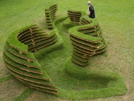 Adam Kalinowski, THE GRAVE, 2010, OSB board, roll up grass, soil